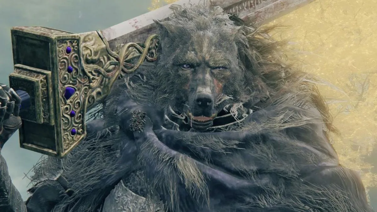 Elden Ring: Where is Blaidd in Nokron? Elden-Ring-Blaidd-official-screenshot-of-Blaidd-holding-a-large-blade-while-standing-in-front-of-the-Erdtree