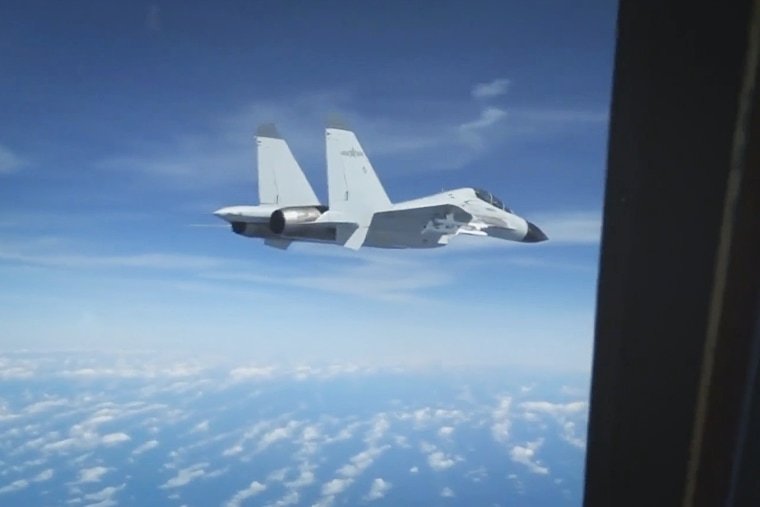 Footage captured on Dec. 21, 2022 shows a Chinese fighter jet flying close to a U.S. surveillance plane in international airspace over the South China Sea. 